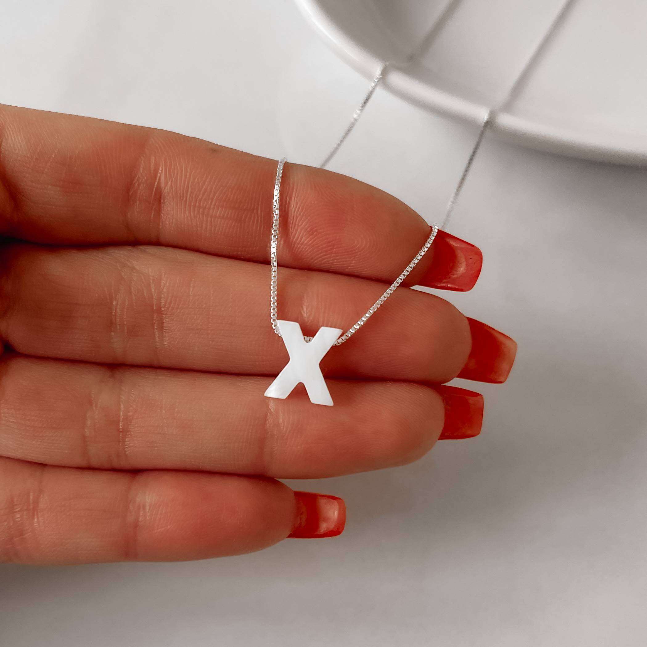 Imagem Secundária Colar madrepérola letra X 45cm