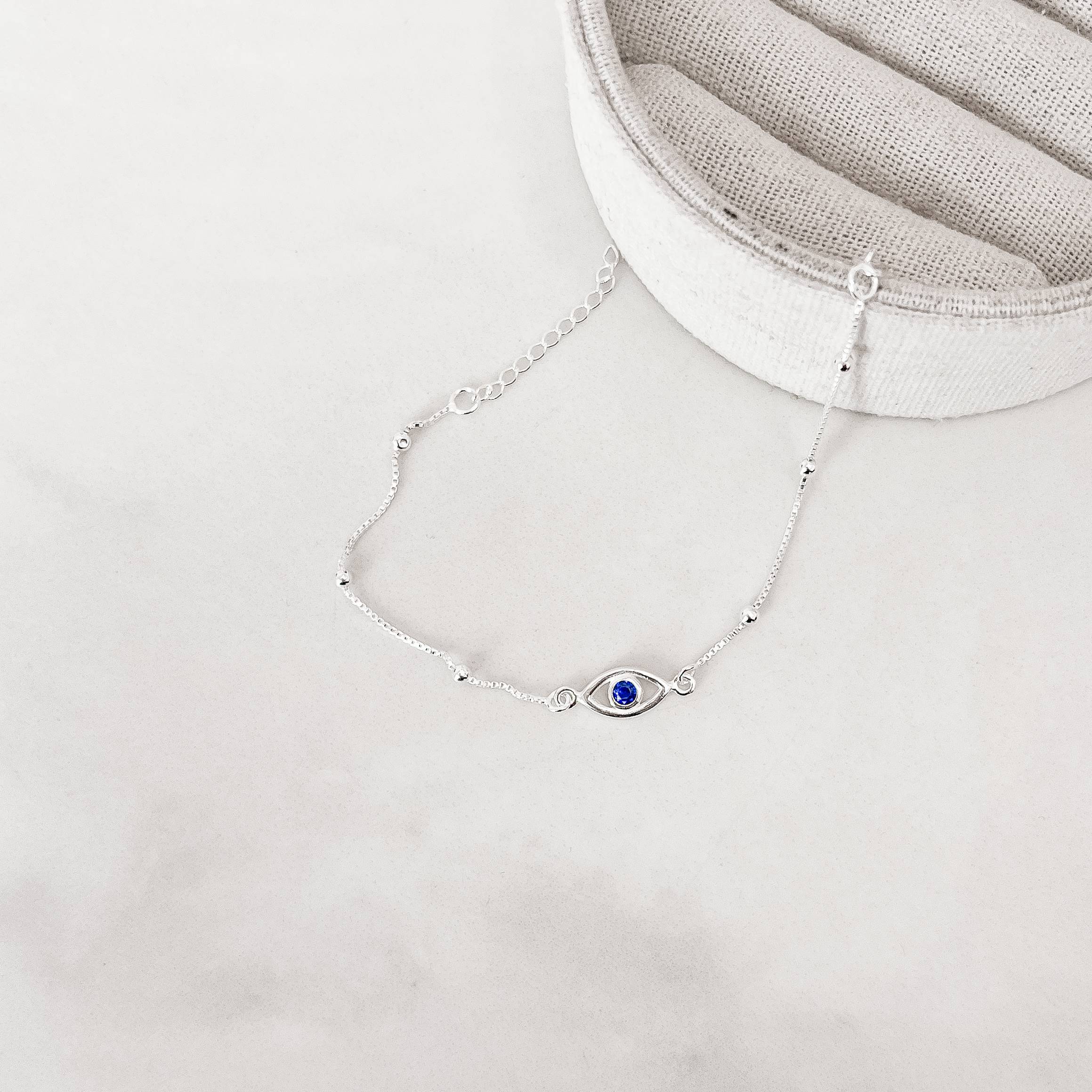 Pulseira entremeios olho grego 12mm com bolas