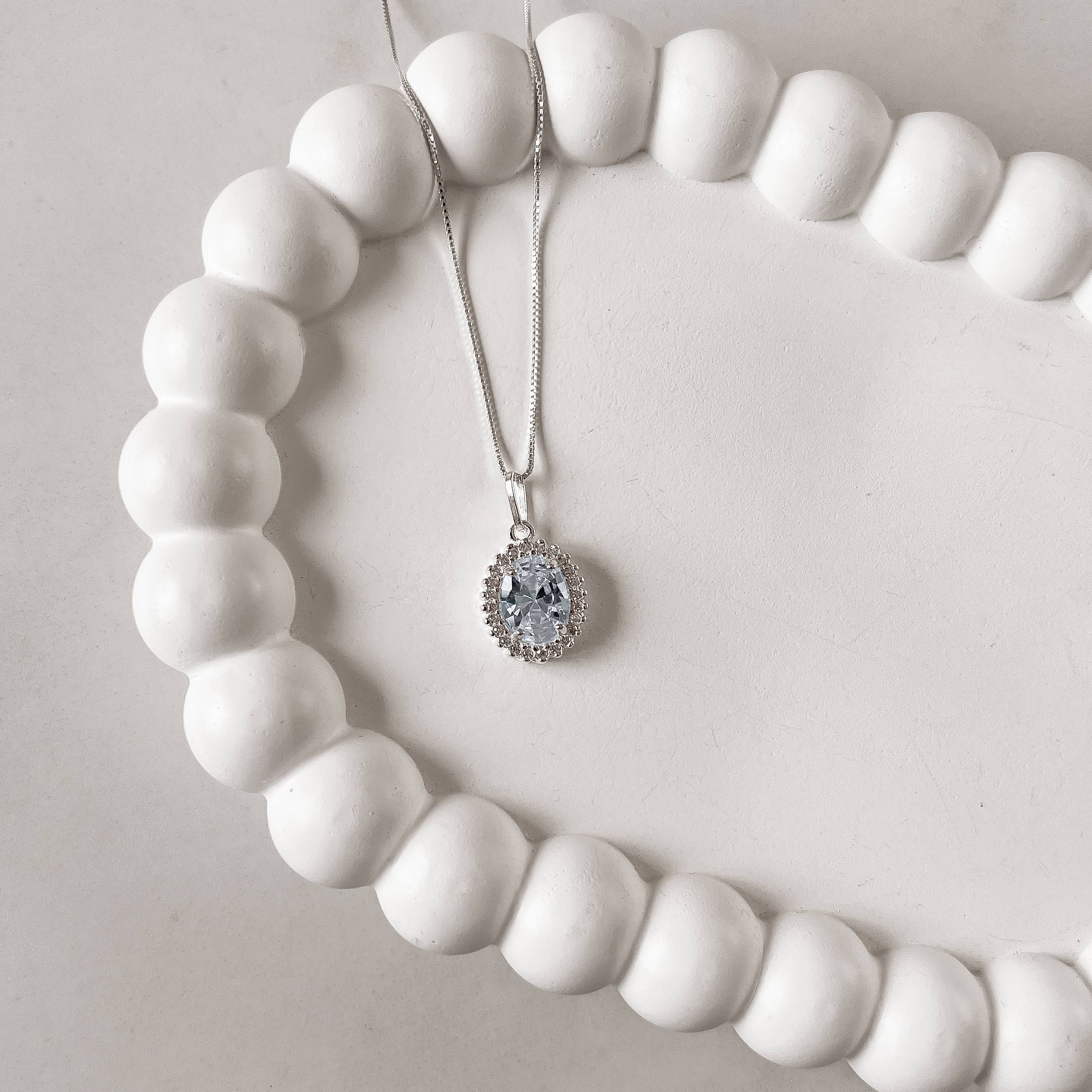 Imagem Colar pingente zircônia oval azul claro com cravejado 15mm 45cm