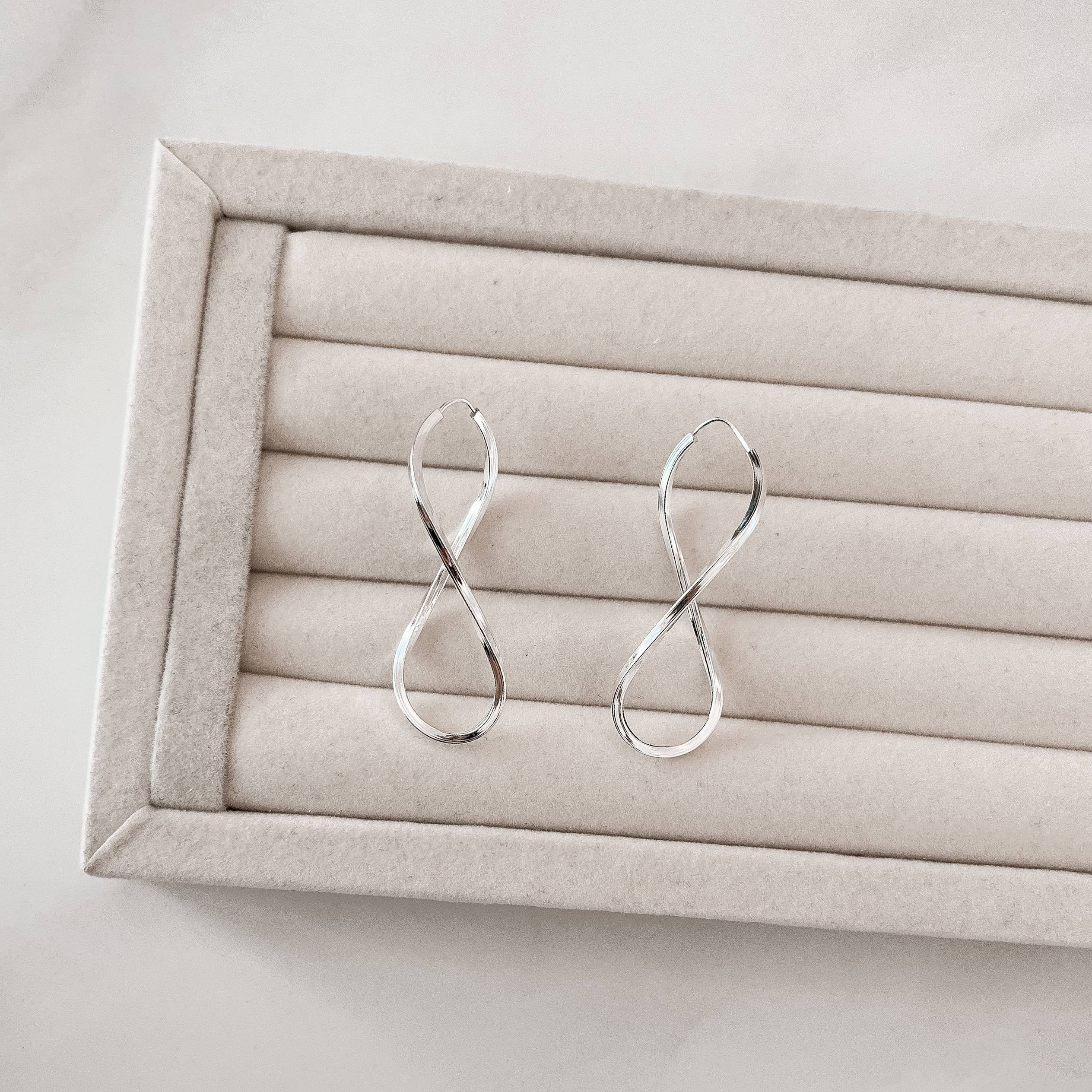 Imagem Argola infinito 50mm fio quadrado