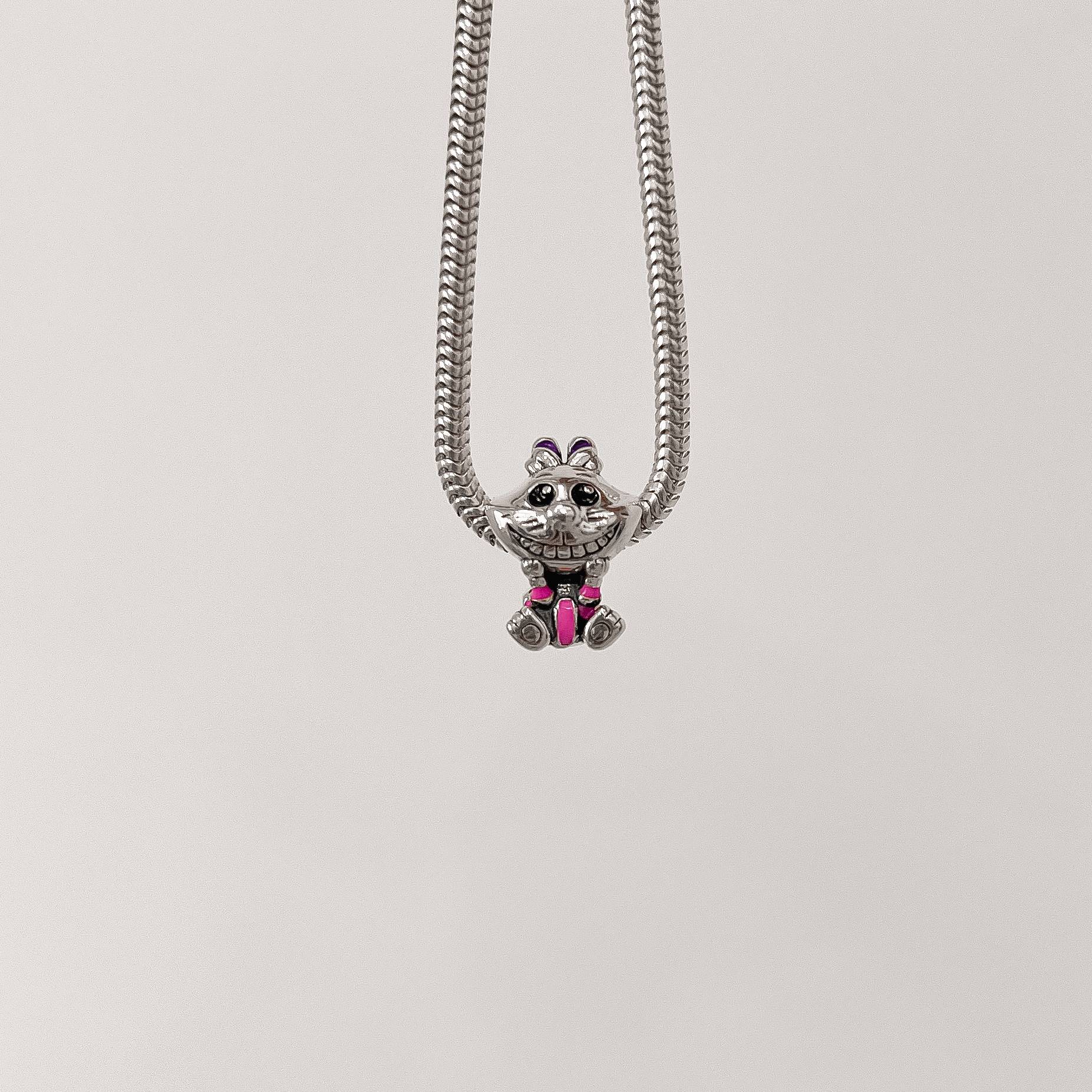 Berloque separador Gato de Cheshire resina 15mm envelhecido