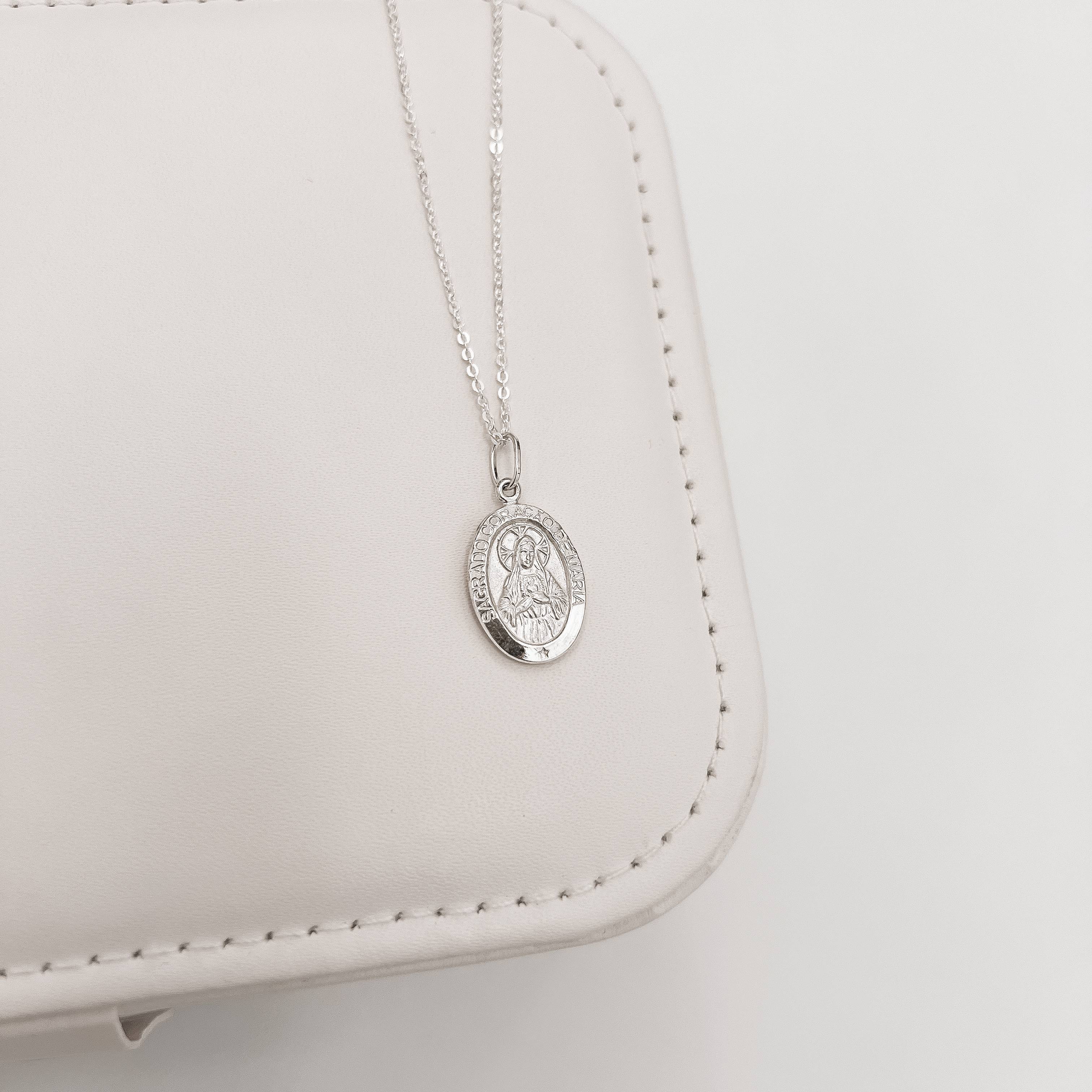 Imagem Secundária Colar pingente medalha dupla face Sagrado Coração de Maria e cruz 16mm corrente cadeadinho 45cm