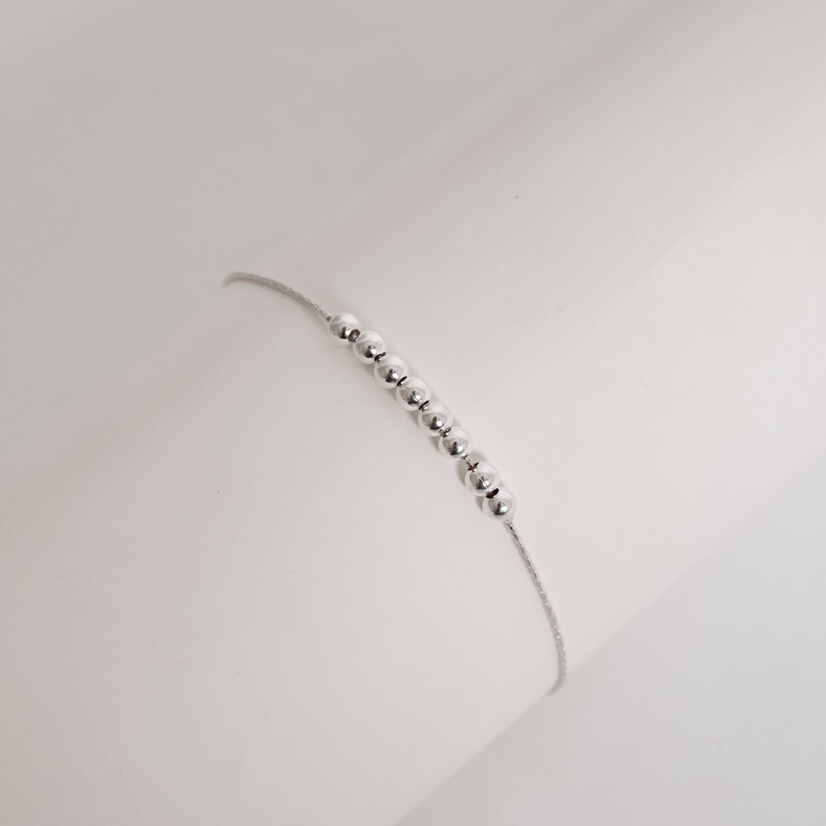 Imagem Secundária Pulseira entremeio bolas 4mm regulável fecho bola