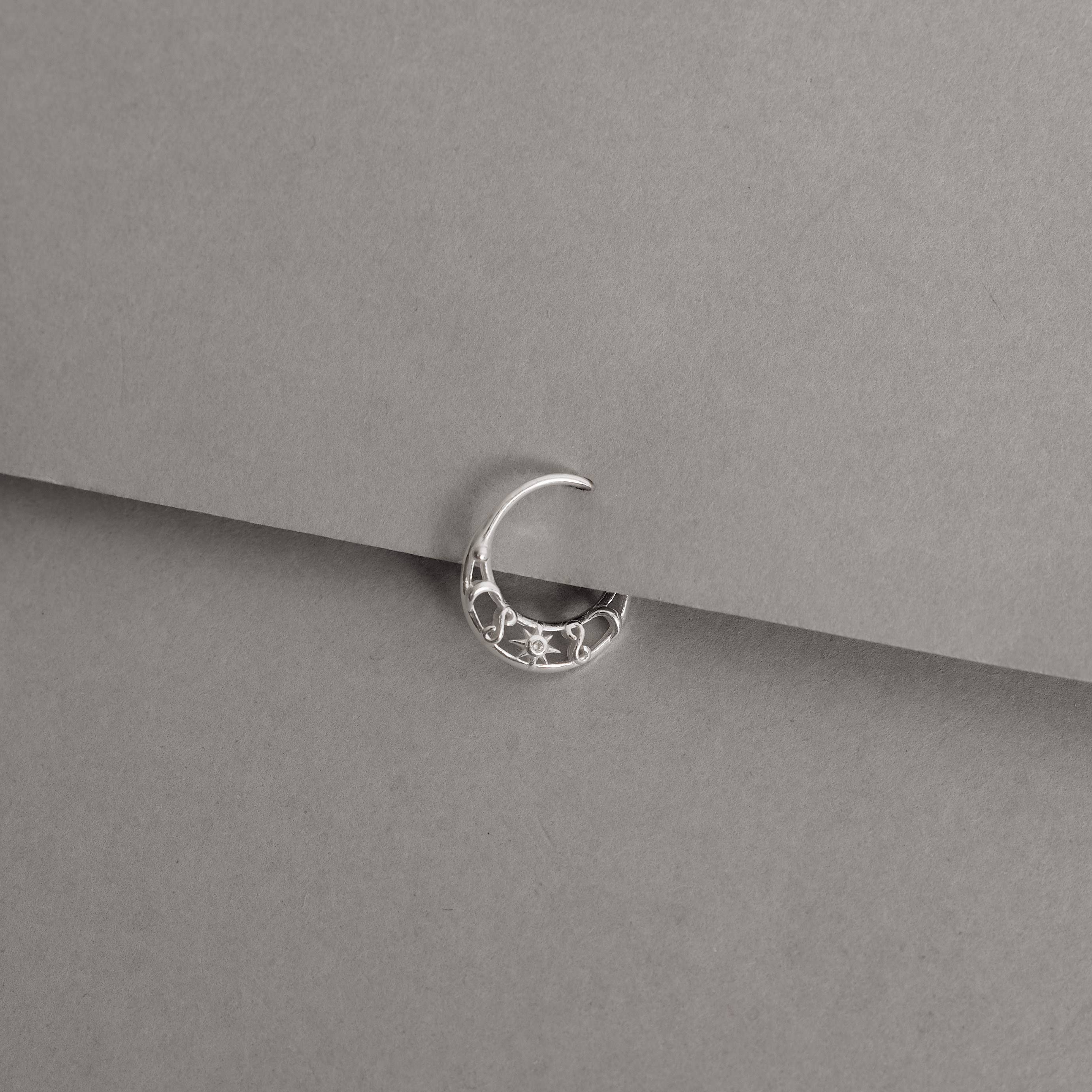 Imagem Secundária Piercing argola detalhe lua, sol com zircônia e infinito 12mm