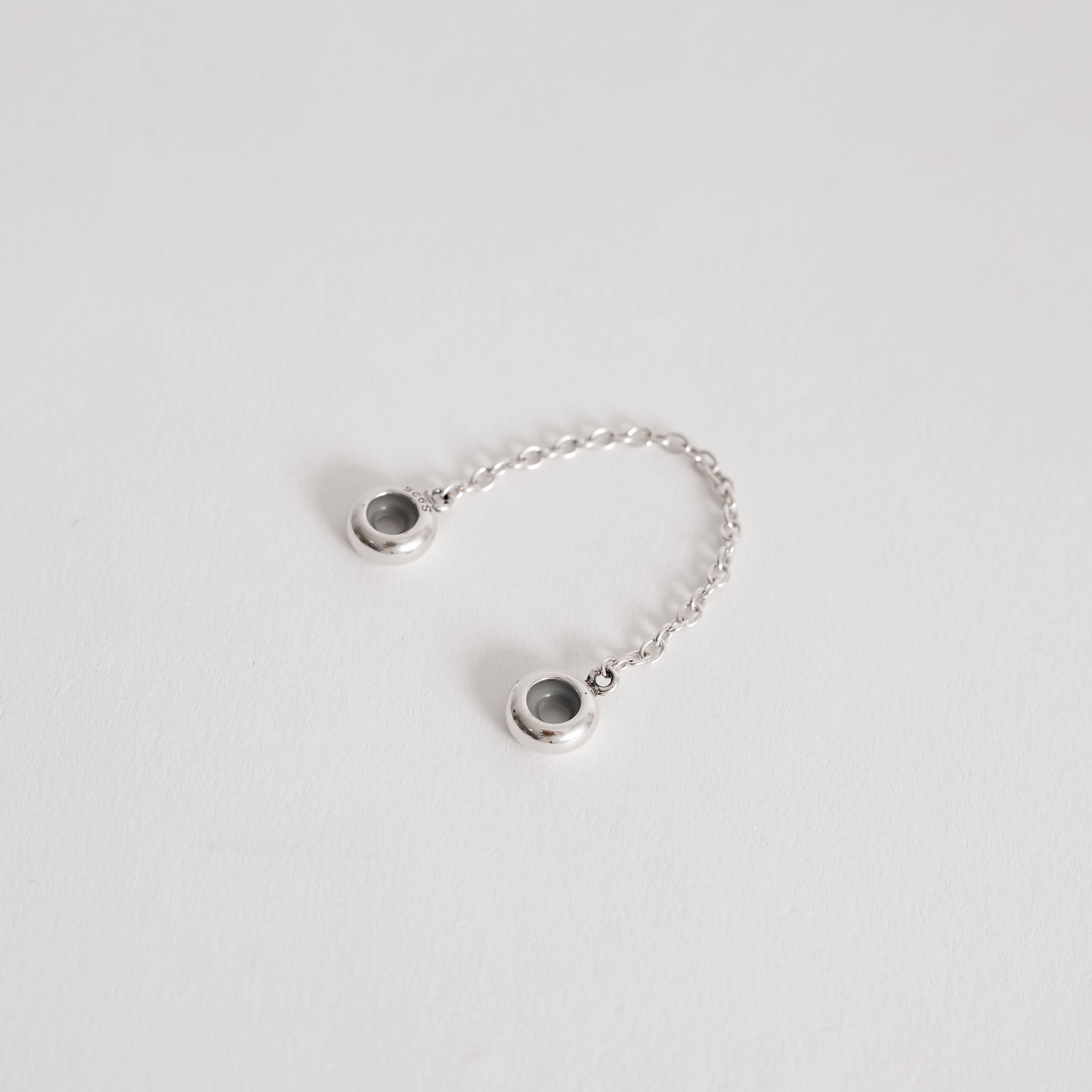 Berloque trava silicone envelhecido