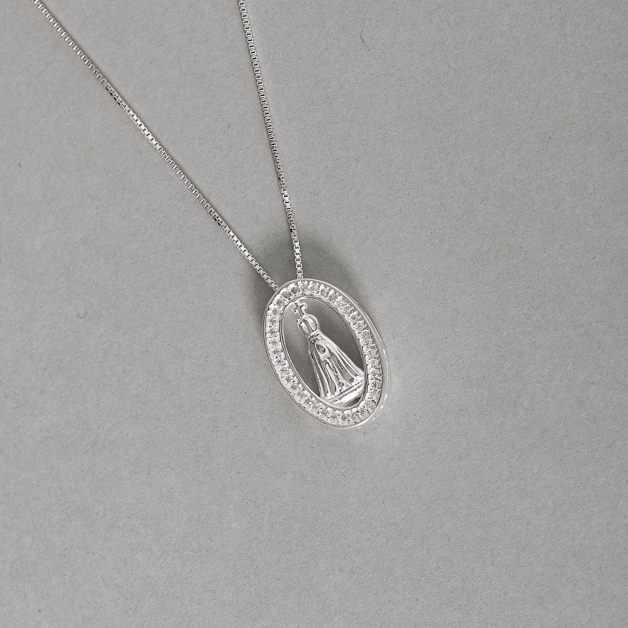 Imagem Colar medalha oval Nsa. Sra. Aparecida cravejada 18mm 45cm