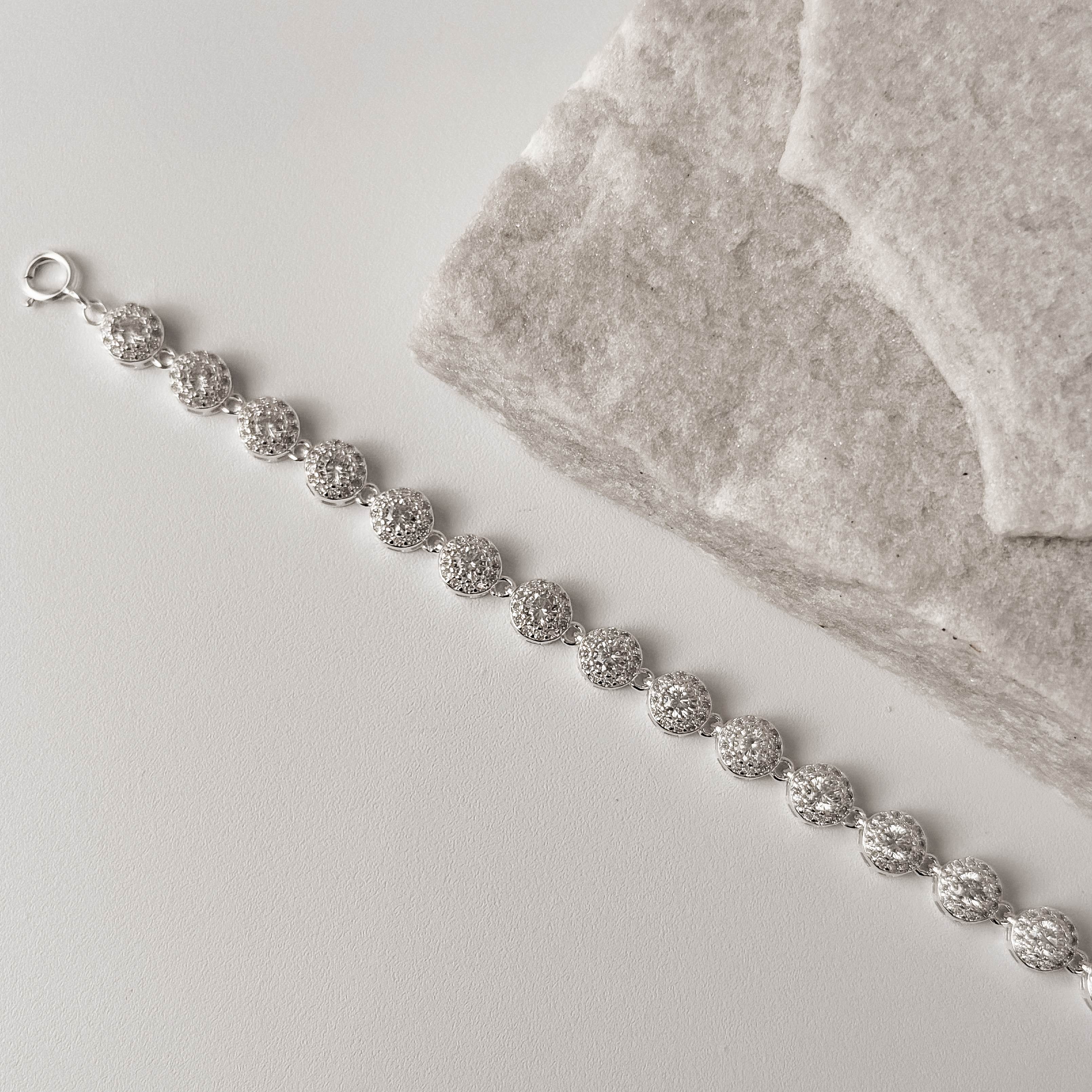 Imagem Pulseira entremeios zircônias redonda com cravejado 5.9 16+4cm