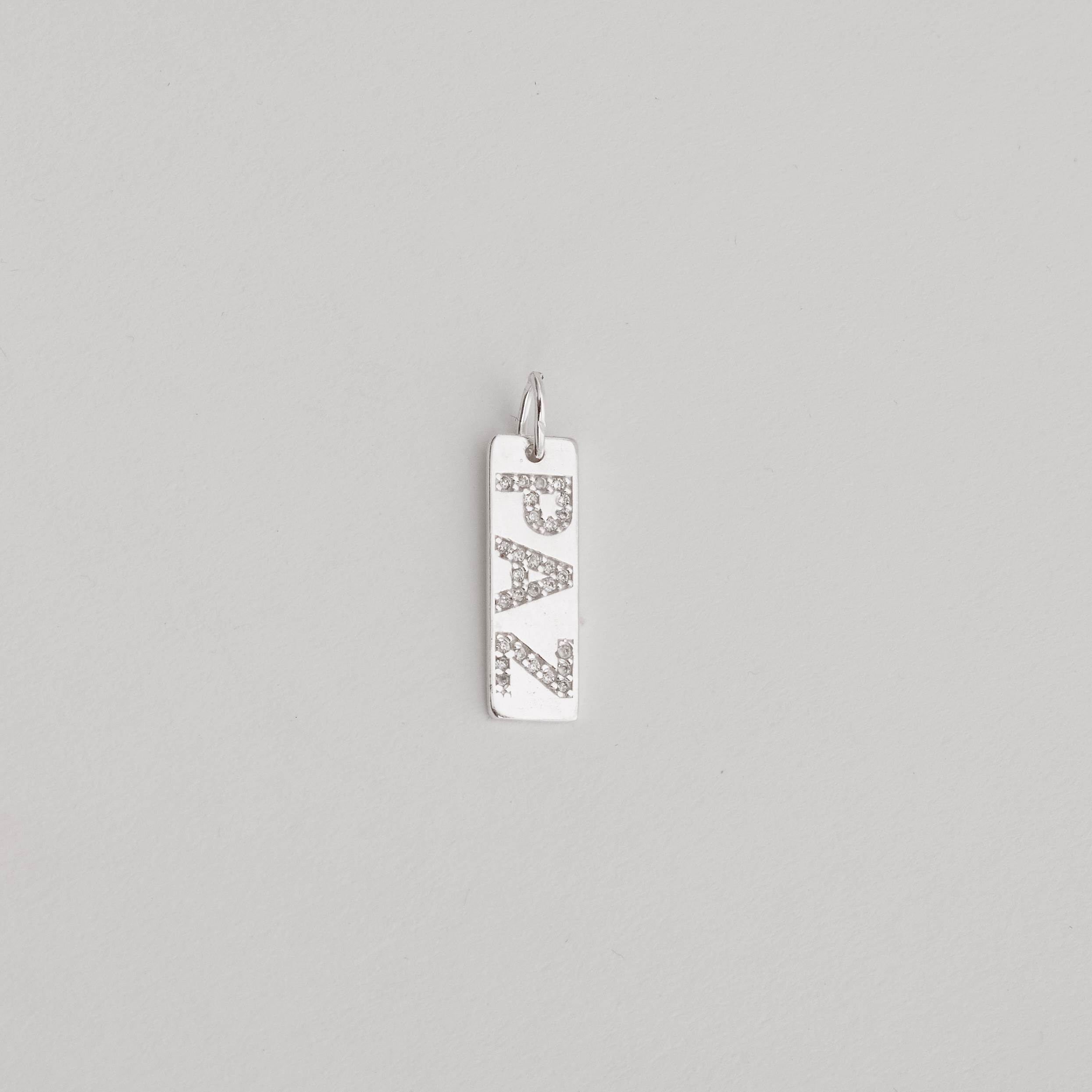 Imagem Pingente placa paz cravejada 22mm
