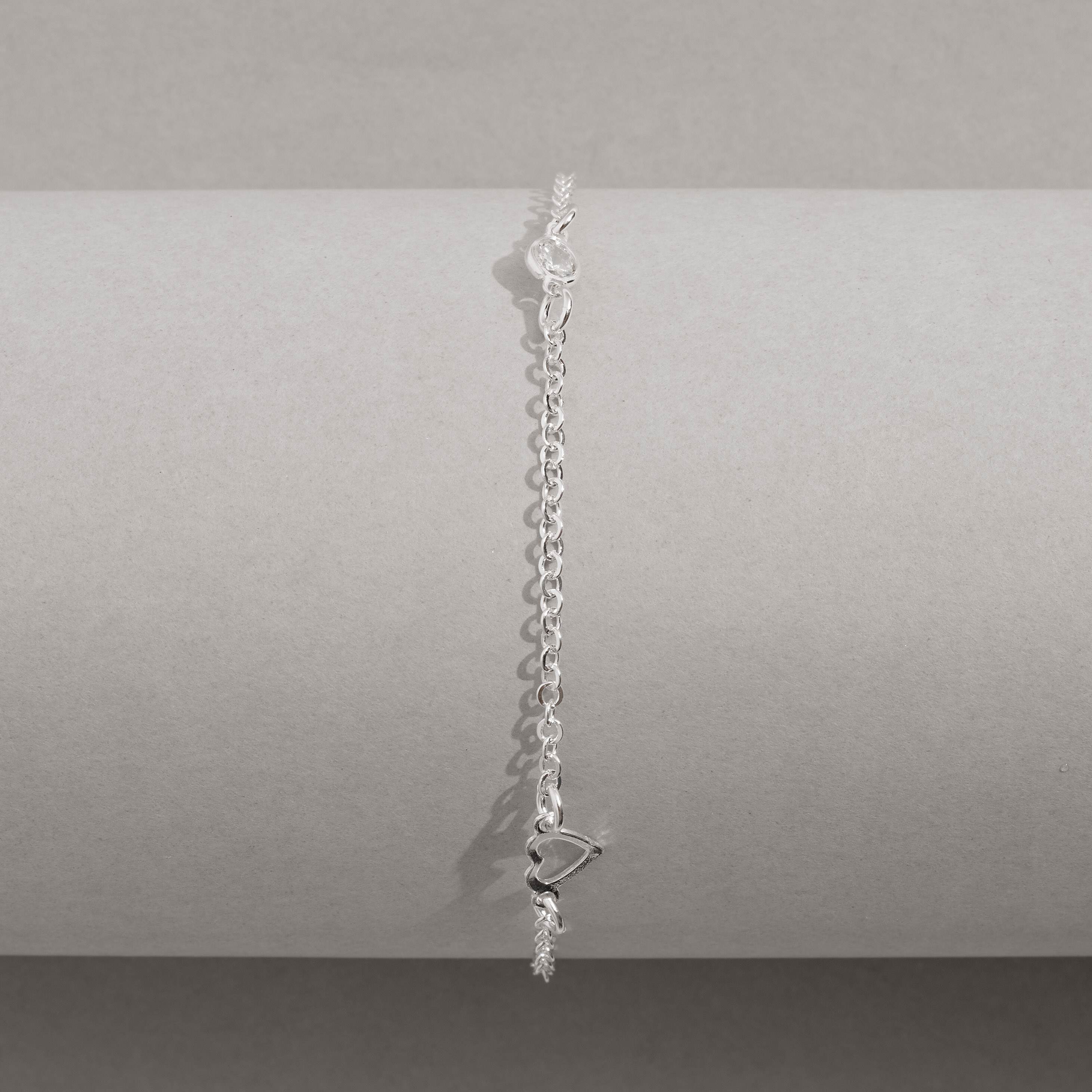 Imagem Secundária Pulseira entremeios zircônias 4mm e coração vazado 19cm
