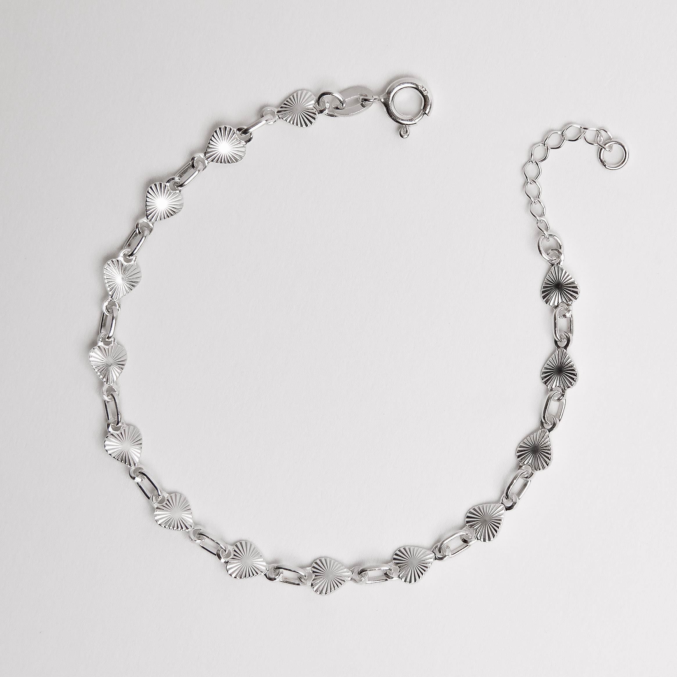 Imagem Pulseira entremeio corações com vinco 5mm