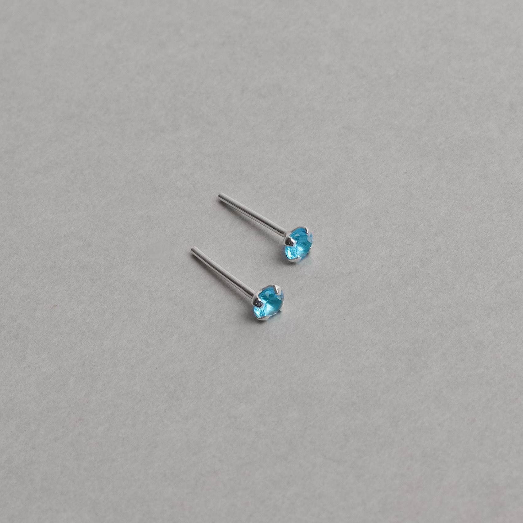 Brinco zircônia redonda azul 3mm garra