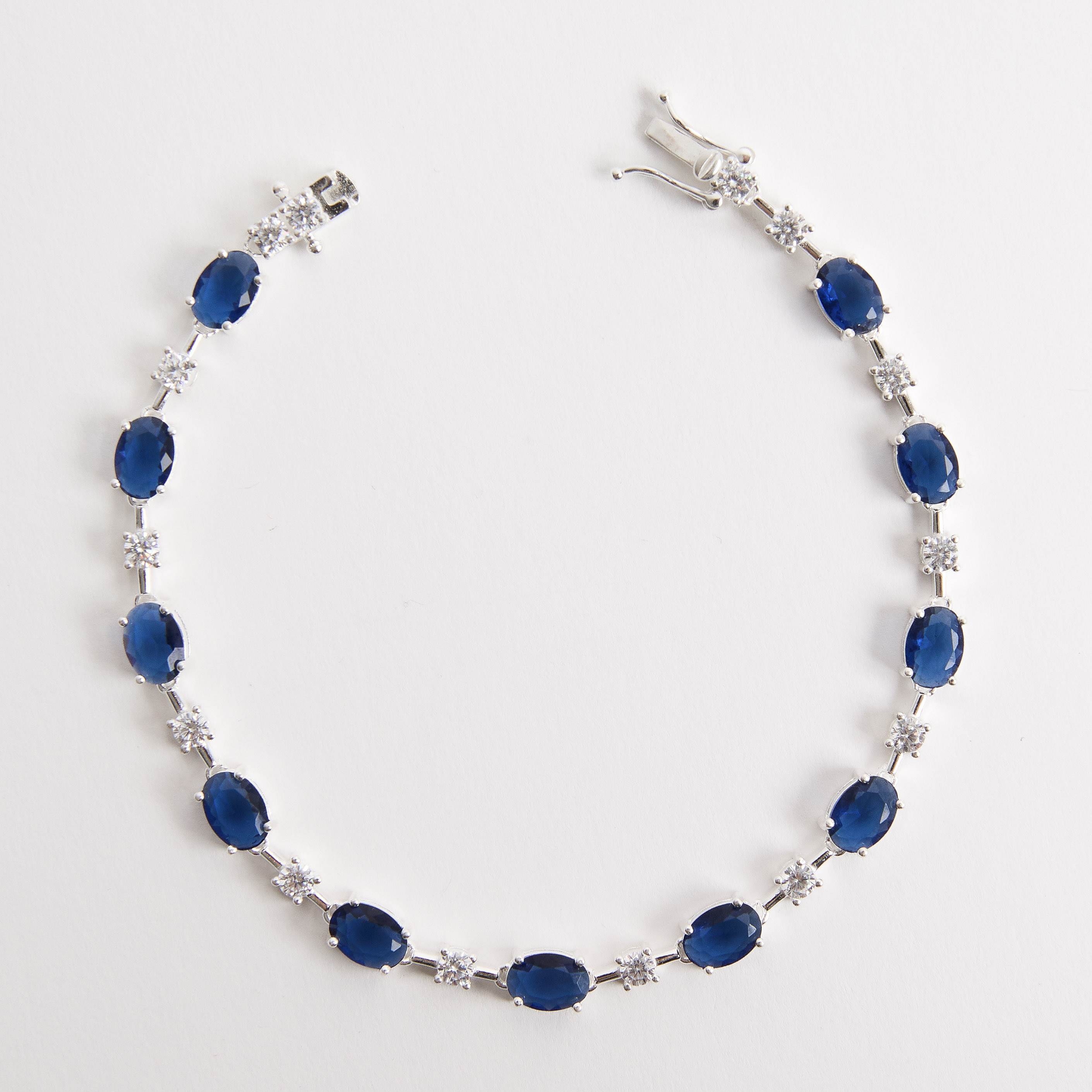 Pulseira Riviera fio faca zircônias ovais safira e redondas cristal 18,5cm fecho gaveta