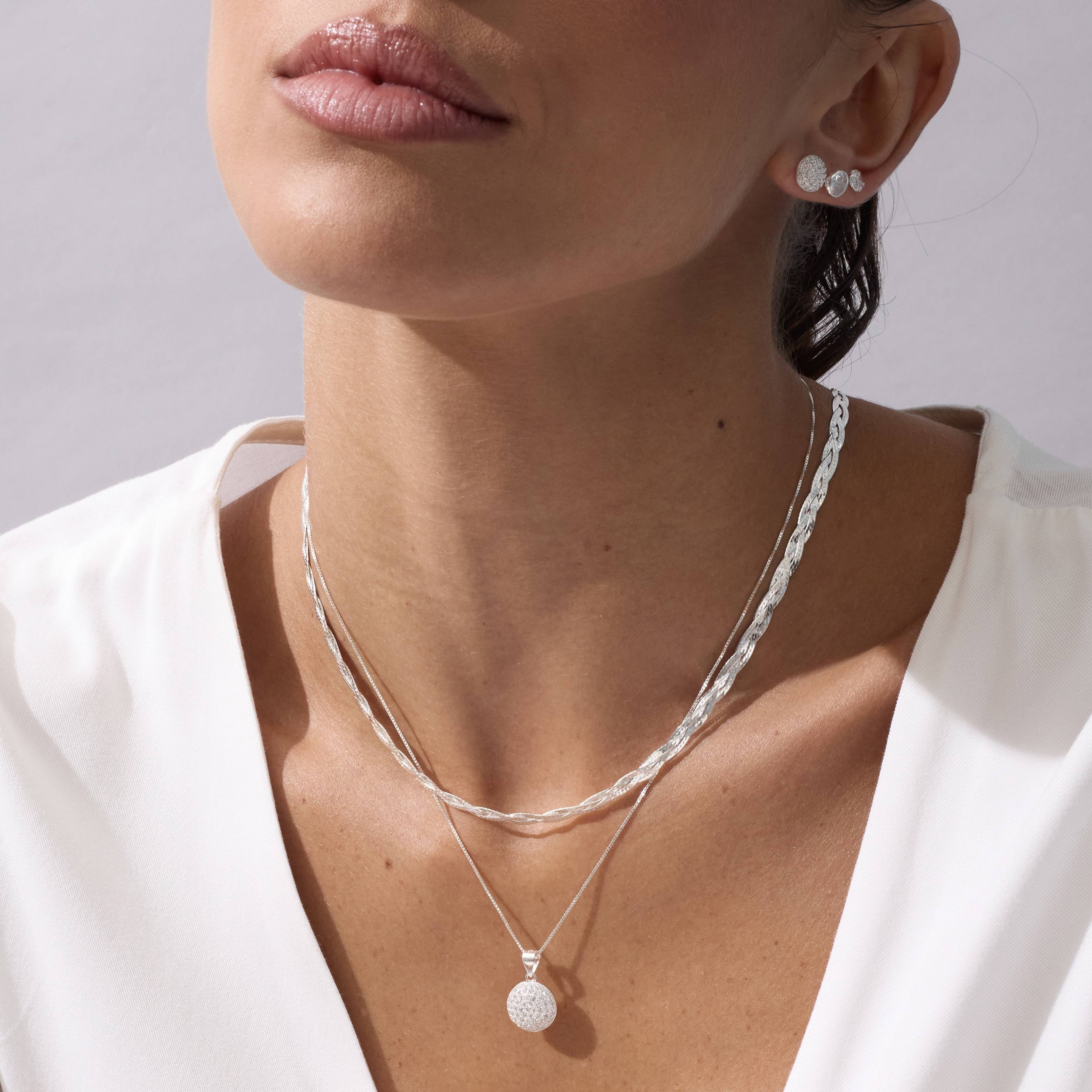 Imagem Secundária Brinco zircônia redonda cristal embutida 6mm