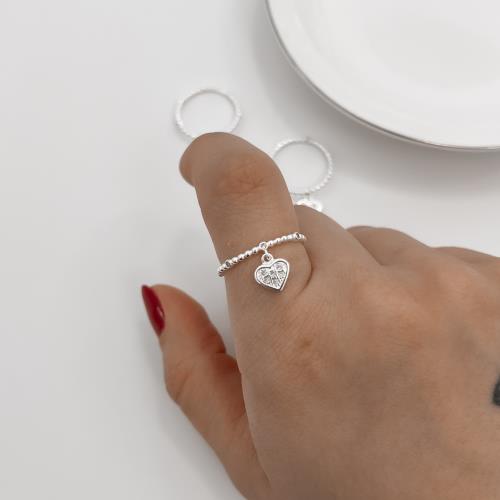 Anel fio bolinhas e zircônias com pingente coração cravejado